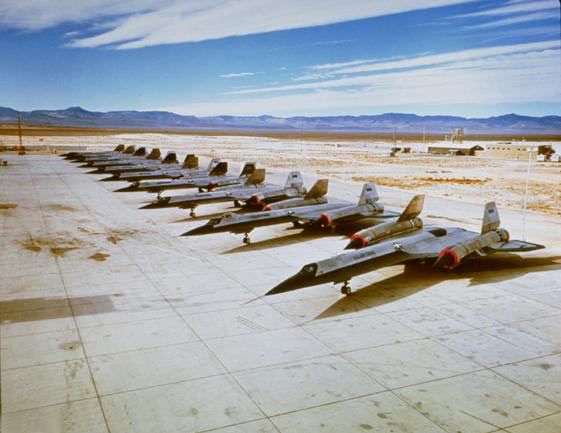 OXCART aircraft on the ramp at Groom Lake Area 51 in 1964. There are ten aircraft in the photo; the first eight are OXCART machines, and the last two are Air Force YF-12As